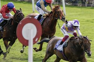 YORK, ENGLAND - AUGUST 26: Frankie Dettori riding Kinross celebrate winning The Sky Bet City Of York Stakes at York Racecourse on August 26, 2023 in York, England. (Photo by Alan Crowhurst/Getty Images)