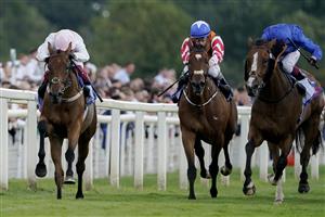 YORK, ENGLAND - AUGUST 26: Frankie Dettori riding Absurde (L, pink) win The Sky Bet Ebor Handicap at York Racecourse on August 26, 2023 in York, England. (Photo by Alan Crowhurst/Getty Images)