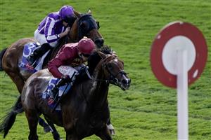 YORK, ENGLAND - AUGUST 26: Oisin Murphy riding Middle Earth (maroon) win The Sky Bet Melrose Handicap at York Racecourse on August 26, 2023 in York, England. (Photo by Alan Crowhurst/Getty Images)