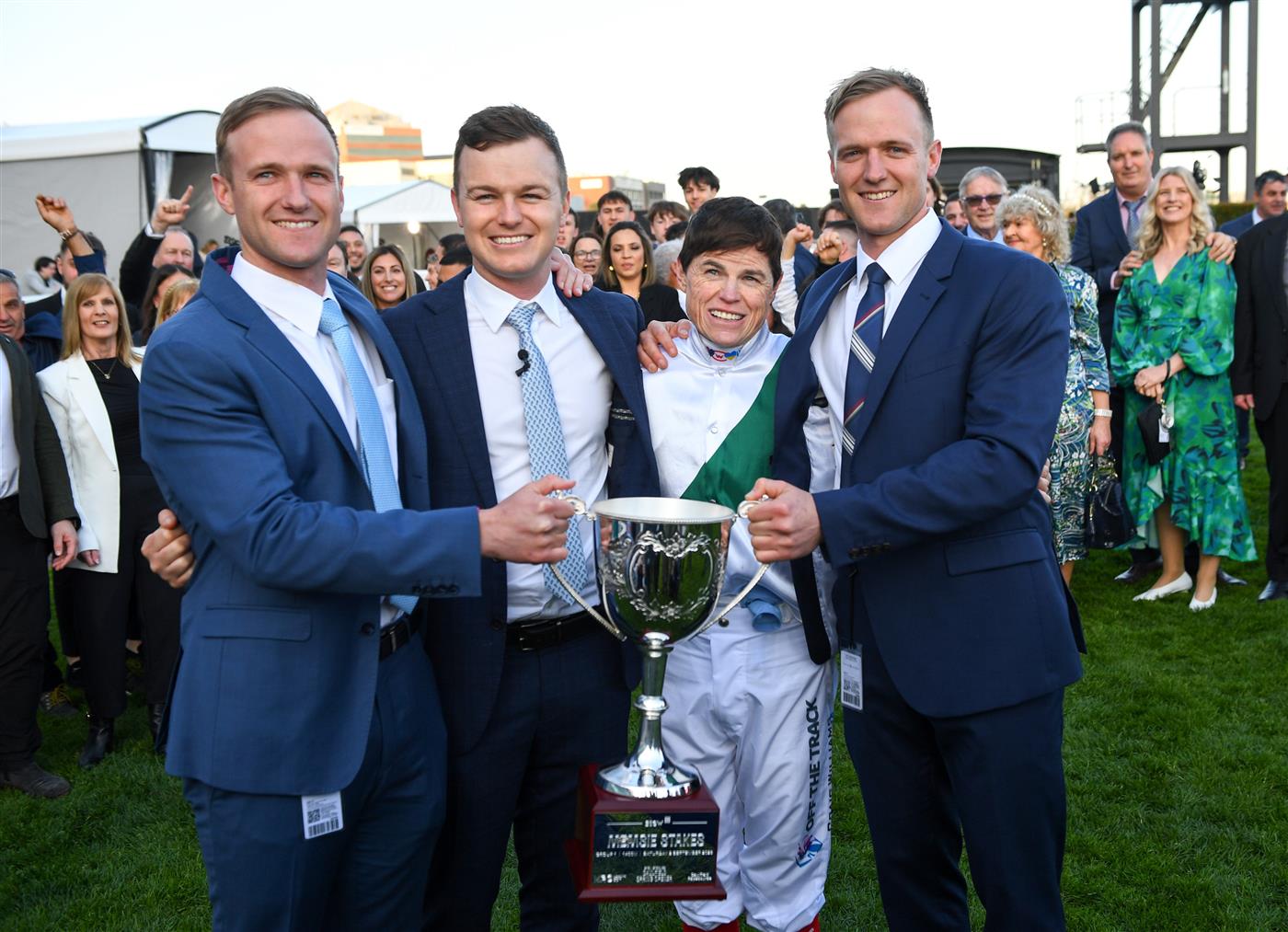 MELBOURNE, AUSTRALIA - SEPTEMBER 02: Trainers JD Hayes, Ben Hayes and Will Hayes (r) pose with Craig Williams and trophy after Mr Brightside wo in Race 9, the Stow Storage Memsie Stakes, during Melbourne Racing at Caulfield Racecourse on September 02, 2023 in Melbourne, Australia. (Photo by Vince Caligiuri/Getty Images)