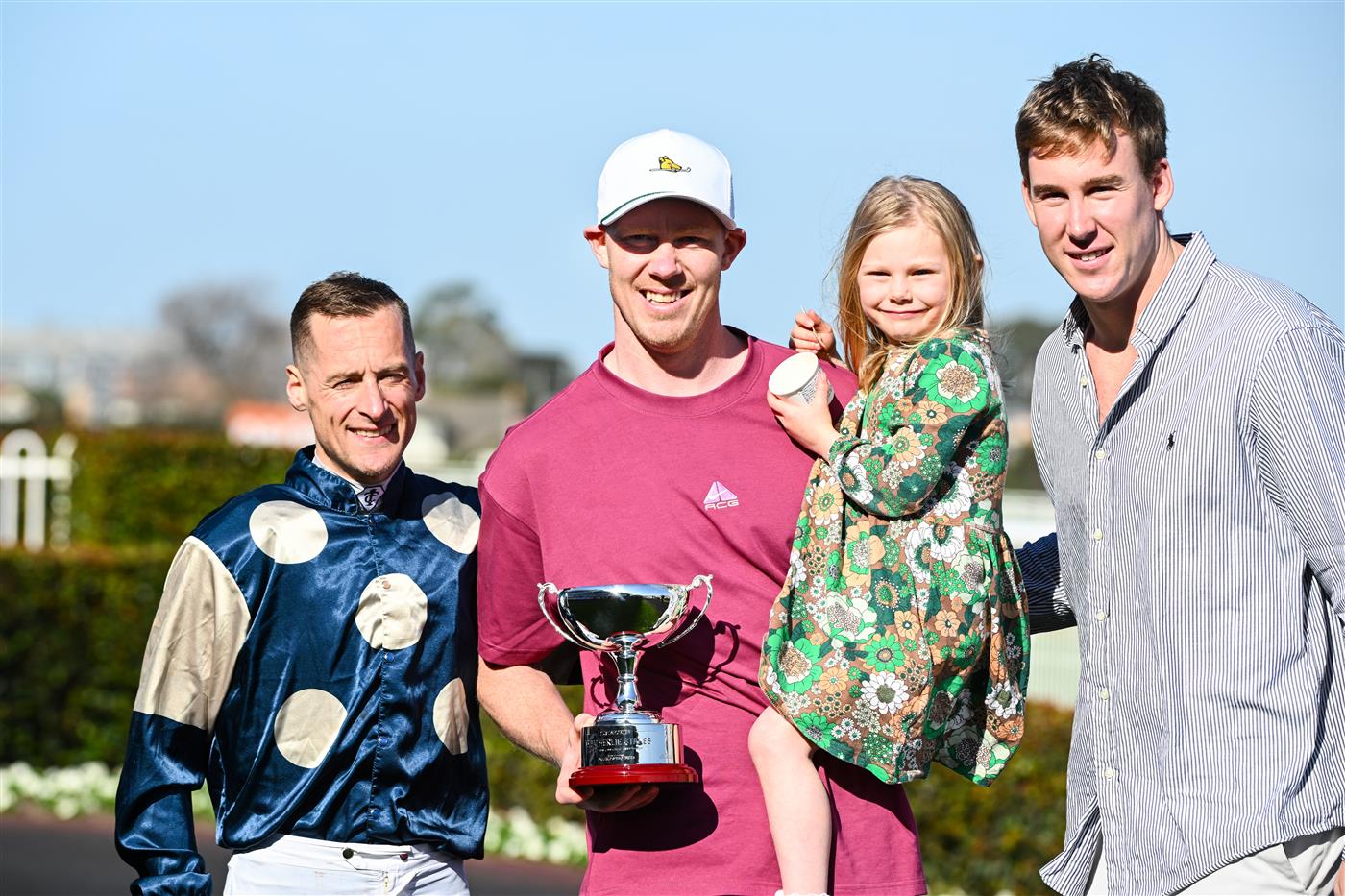 MELBOURNE, AUSTRALIA - SEPTEMBER 02: Winning connections Jack Riewoldt and daughter Poppy Riewoldt and Tom Lynch pose with Blake Shinn after Soulcombe won Race 6, the Tile Importer Heatherlie Stakes, during Melbourne Racing at Caulfield Racecourse on September 02, 2023 in Melbourne, Australia. (Photo by Vince Caligiuri/Getty Images)