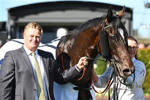 MELBOURNE, AUSTRALIA - SEPTEMBER 02: Trainer Calvin McEvoy poses with Veight after winning in Race 5, the Ive Mcneil Stakes,  during Melbourne Racing at Caulfield Racecourse on September 02, 2023 in Melbourne, Australia. (Photo by Vince Caligiuri/Getty Images)