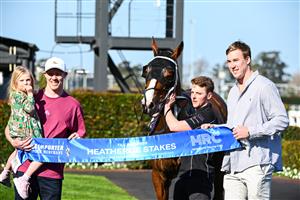 MELBOURNE, AUSTRALIA - SEPTEMBER 02: Winning connections Jack Riewoldt and daughter Poppy Riewoldt and Tom Lynch pose after Soulcombe won Race 6, the Tile Importer Heatherlie Stakes, during Melbourne Racing at Caulfield Racecourse on September 02, 2023 in Melbourne, Australia. (Photo by Vince Caligiuri/Getty Images)