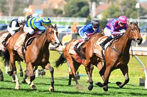 MELBOURNE, AUSTRALIA - SEPTEMBER 02: Michael Dee riding Rheinberg defeats Chorlton Lane (L) in Race 2, the Changing Places Real Estate Handicap,  during Melbourne Racing at Caulfield Racecourse on September 02, 2023 in Melbourne, Australia. (Photo by Vince Caligiuri/Getty Images)