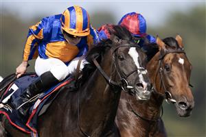 DUBLIN, IRELAND - SEPTEMBER 09: Ryan Moore riding Auguste Rodin (orange/blue) win The Royal Bahrain Irish Champion Stakes from Seamie Heffernan and Luxembourg (red/blue) at Leopardstown Racecourse on September 09, 2023 in Dublin, Ireland. (Photo by Alan Crowhurst/Getty Images)