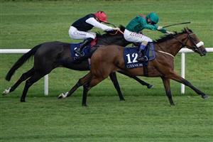 DUBLIN, IRELAND - SEPTEMBER 09: Chris Hayes riding Tahiyra (green) win The Coolmore America