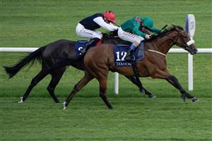 DUBLIN, IRELAND - SEPTEMBER 09: Chris Hayes riding Tahiyra (green) win The Coolmore America