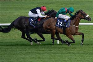 DUBLIN, IRELAND - SEPTEMBER 09: Chris Hayes riding Tahiyra (green) win The Coolmore America