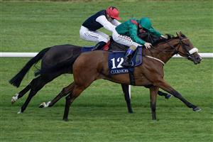 DUBLIN, IRELAND - SEPTEMBER 09: Chris Hayes riding Tahiyra (green) win The Coolmore America