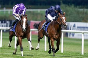 DUBLIN, IRELAND - SEPTEMBER 09: Ryan Moore riding Diego Velazquez (purple/white) win The KPMG Champions Juvenile Stakes from Seamie Heffernan and Capulet (dark blue) at Leopardstown Racecourse on September 09, 2023 in Dublin, Ireland. (Photo by Alan Crowhurst/Getty Images)