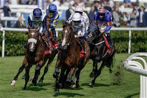 DONCASTER, ENGLAND - SEPTEMBER 15: Runners in The Betfred Doncaster Cup Stakes turn towards the back straight at Doncaster Racecourse on September 15, 2023 in Doncaster, England. (Photo by Alan Crowhurst/Getty Images)