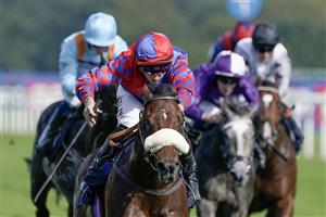 DONCASTER, ENGLAND - SEPTEMBER 15: Tom Marquand riding Big Evs (red/blue) win The Carlsberg Danish Pilsner Flying Childers Stakes at Doncaster Racecourse on September 15, 2023 in Doncaster, England. (Photo by Alan Crowhurst/Getty Images)