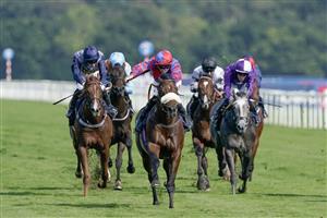 DONCASTER, ENGLAND - SEPTEMBER 15: Tom Marquand riding Big Evs (red/blue) win The Carlsberg Danish Pilsner Flying Childers Stakes at Doncaster Racecourse on September 15, 2023 in Doncaster, England. (Photo by Alan Crowhurst/Getty Images)
