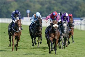 DONCASTER, ENGLAND - SEPTEMBER 15: Tom Marquand riding Big Evs (red/blue) win The Carlsberg Danish Pilsner Flying Childers Stakes at Doncaster Racecourse on September 15, 2023 in Doncaster, England. (Photo by Alan Crowhurst/Getty Images)