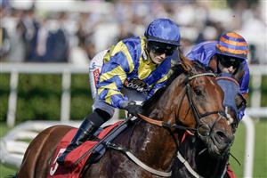 DONCASTER, ENGLAND - SEPTEMBER 15: Hollie Doyle riding Trueshan (blue/yellow) on their way to winning The Betfred Doncaster Cup Stakes at Doncaster Racecourse on September 15, 2023 in Doncaster, England. (Photo by Alan Crowhurst/Getty Images)