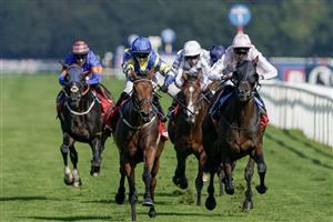 DONCASTER, ENGLAND - SEPTEMBER 15: Hollie Doyle riding Trueshan (blue/yellow) win The Betfred Doncaster Cup Stakes at Doncaster Racecourse on September 15, 2023 in Doncaster, England. (Photo by Alan Crowhurst/Getty Images)