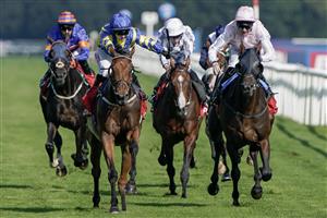 DONCASTER, ENGLAND - SEPTEMBER 15: Hollie Doyle riding Trueshan (blue/yellow) win The Betfred Doncaster Cup Stakes at Doncaster Racecourse on September 15, 2023 in Doncaster, England. (Photo by Alan Crowhurst/Getty Images)