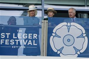 DONCASTER, ENGLAND - SEPTEMBER 16: Queen Camilla (L) Lady Halifax (C) and King Charles III (R) on the balcony watching The Betfred Park Stakes at Doncaster Racecourse on September 16, 2023 in Doncaster, England. (Photo by Alan Crowhurst/Getty Images)