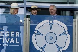 DONCASTER, ENGLAND - SEPTEMBER 16: Queen Camilla (L) Lady Halifax (C) and King Charles III (R) on the balcony watching The Betfred Park Stakes at Doncaster Racecourse on September 16, 2023 in Doncaster, England. (Photo by Alan Crowhurst/Getty Images)