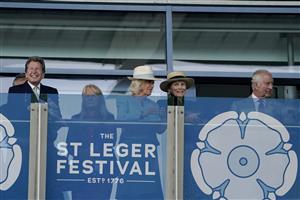 DONCASTER, ENGLAND - SEPTEMBER 16: John Warren (L), Queen Camilla (C) Lady Halifax (2R) and King Charles III (R) on the balcony watching The Betfred Park Stakes at Doncaster Racecourse on September 16, 2023 in Doncaster, England. (Photo by Alan Crowhurst/Getty Images)