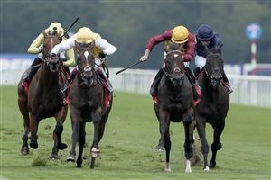 DONCASTER, ENGLAND - SEPTEMBER 16: Tom Marquand riding Iberian (maroon/yellow cap) win The Betfred Champagne Stakes at Doncaster Racecourse on September 16, 2023 in Doncaster, England. (Photo by Alan Crowhurst/Getty Images)
