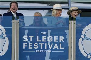 DONCASTER, ENGLAND - SEPTEMBER 16: Queen Camilla (2R) Lady Halifax (R) and John Warren(L) on the balcony watching The Betfred Park Stakes at Doncaster Racecourse on September 16, 2023 in Doncaster, England. (Photo by Alan Crowhurst/Getty Images)