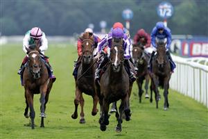 DONCASTER, ENGLAND - SEPTEMBER 16: Ryan Moore riding Continuous (purple/white) win The Betfred St Leger Stakes at Doncaster Racecourse on September 16, 2023 in Doncaster, England. (Photo by Alan Crowhurst/Getty Images)