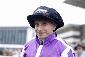 DONCASTER, ENGLAND - SEPTEMBER 16: Jockey Ryan Moore with his winners jockeys cap at Doncaster Racecourse on September 16, 2023 in Doncaster, England. (Photo by Alan Crowhurst/Getty Images)