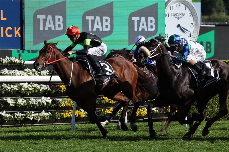 Australian sprinter Think About It, ridden by Sam Clipperton (L), crosses the line first in the world