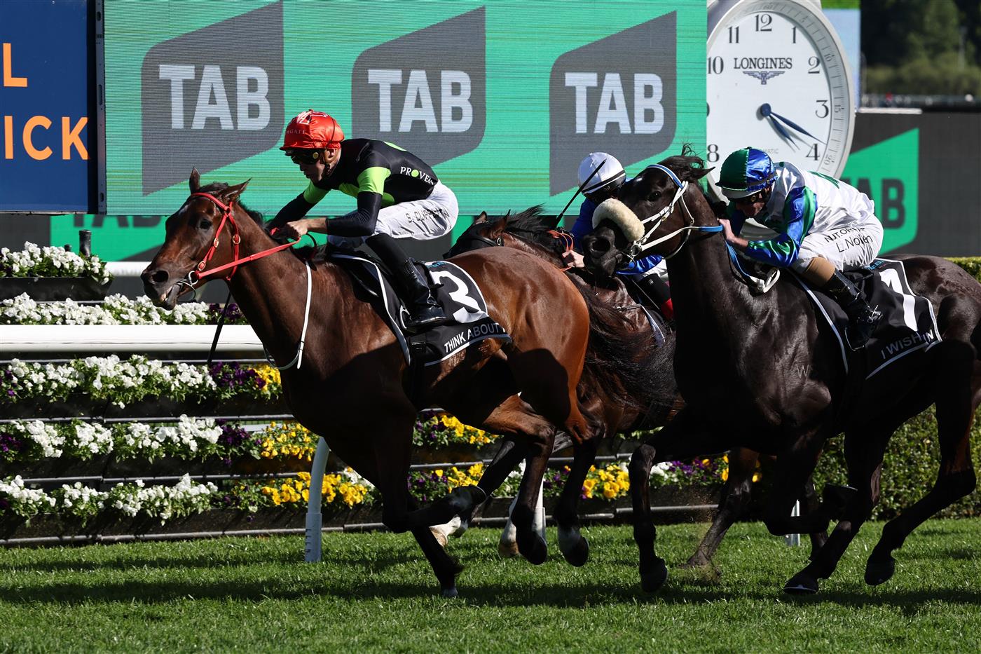 Australian sprinter Think About It, ridden by Sam Clipperton (L), crosses the line first in the world