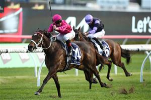 SYDNEY, AUSTRALIA - OCTOBER 14: James McDonald riding Fangirl wins Race 9 The King Charles III Stakes during Sydney Racing at Royal Randwick Racecourse on October 14, 2023 in Sydney, Australia. (Photo by Jason McCawley/Getty Images)