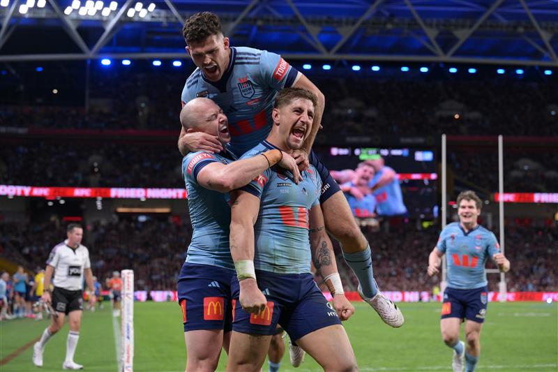 BRISBANE, AUSTRALIA - MAY 28: Zac Lomax of the Blues celebrates scoring a try with Dylan Edwards and Nathan Cleary of the Blues during game one of the Men