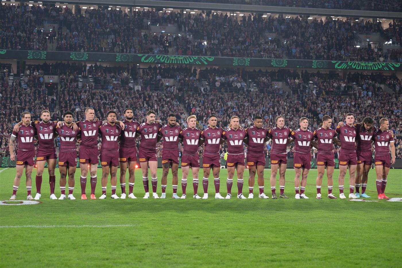 BRISBANE, AUSTRALIA - MAY 28: Maroons players line up for the national anthem ahead of game one of the Men
