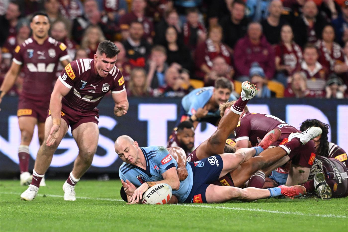 BRISBANE, AUSTRALIA - MAY 28: Dylan Edwards of the Blues scores a try during game one of the Men