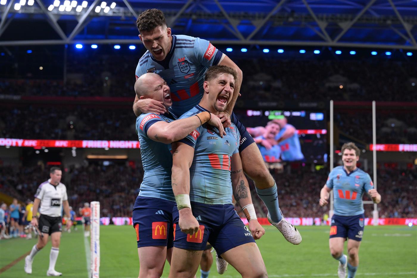 BRISBANE, AUSTRALIA - MAY 28: Zac Lomax of the Blues celebrates scoring a try with Dylan Edwards and Nathan Cleary of the Blues during game one of the Men