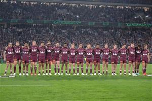 BRISBANE, AUSTRALIA - MAY 28: Maroons players line up for the national anthem ahead of game one of the Men