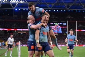 BRISBANE, AUSTRALIA - MAY 28: Zac Lomax of the Blues celebrates scoring a try with Dylan Edwards and Nathan Cleary of the Blues during game one of the Men