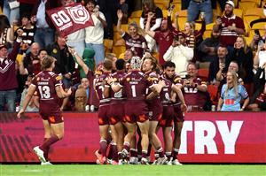 BRISBANE, AUSTRALIA - MAY 28: Xavier Coates of the Maroons celebrates scoring a try with teammates during game one of the Men