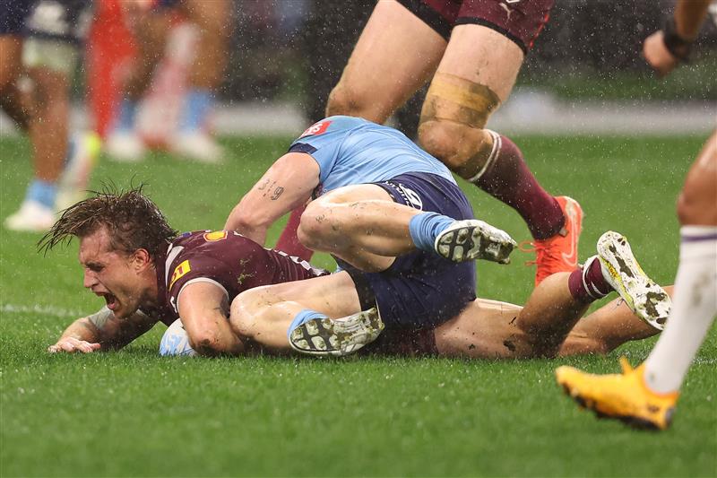 PERTH, AUSTRALIA - JUNE 18: Cameron Munster of the Maroons celebrates scoring a try during game two of the Men