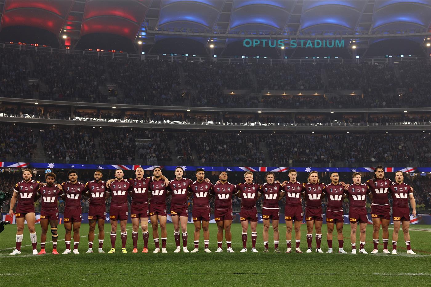 PERTH, AUSTRALIA - JUNE 18: Maroon players line up for the national anthem ahead of game two of the Men