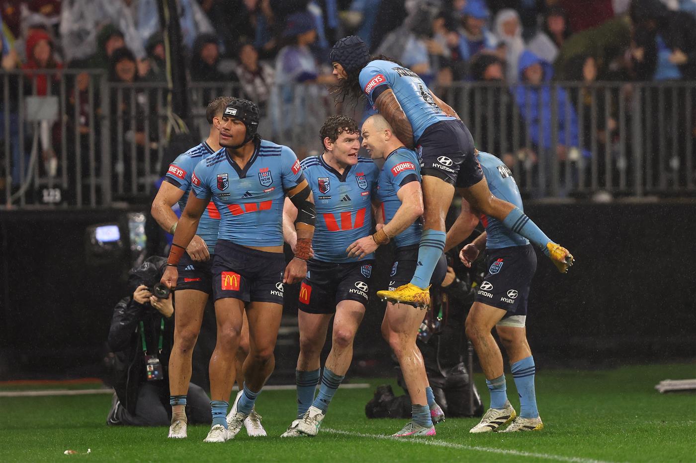 PERTH, AUSTRALIA - JUNE 18: Stephen Crichton of the Blues celebrates scoring a try with teammates during game two of the Men
