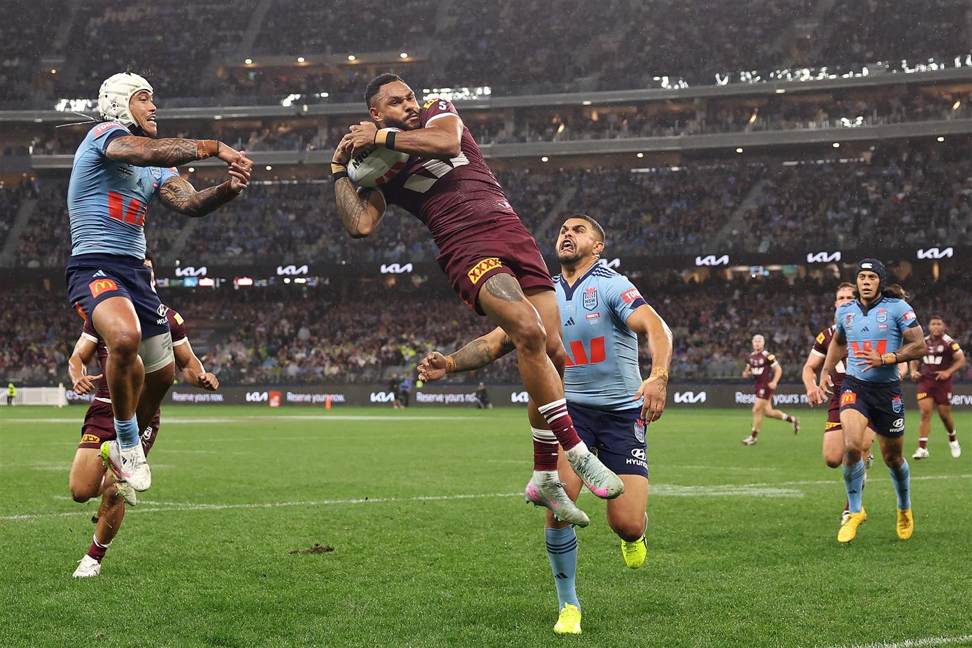 PERTH, AUSTRALIA - JUNE 18: Hamiso Tabuai-Fidow of the Maroons scores his second try during game two of the Men