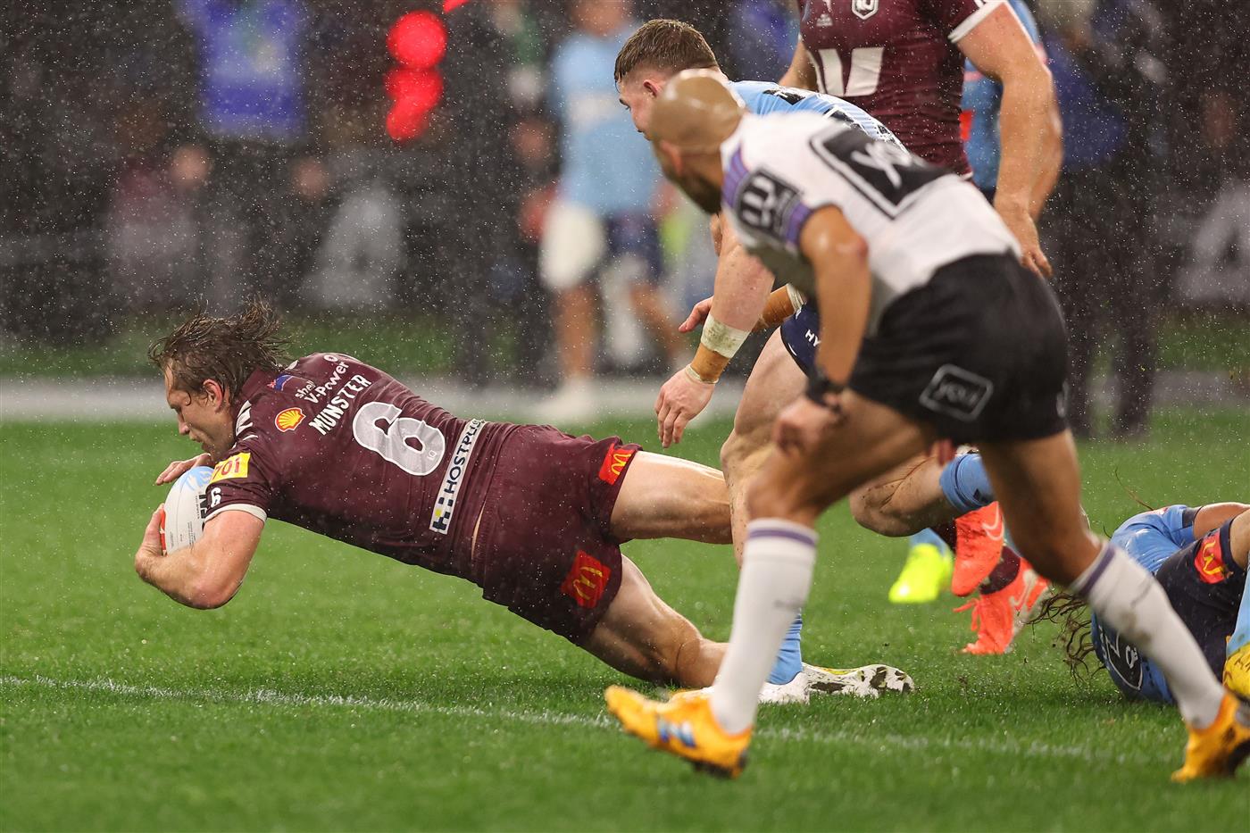 PERTH, AUSTRALIA - JUNE 18: Cameron Munster of the Maroons scores a try during game two of the Men