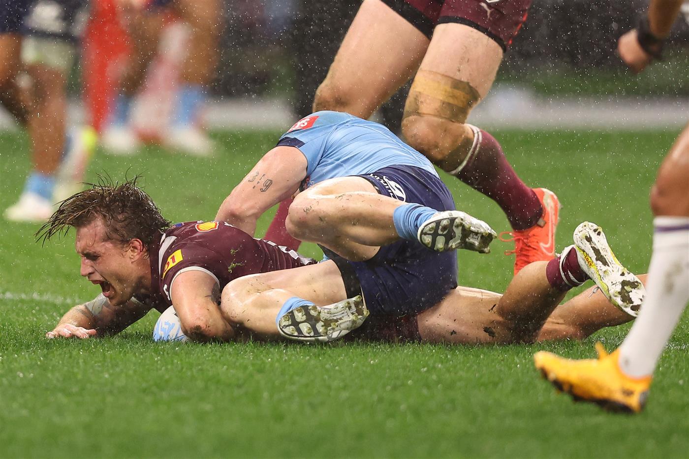 PERTH, AUSTRALIA - JUNE 18: Cameron Munster of the Maroons celebrates scoring a try during game two of the Men