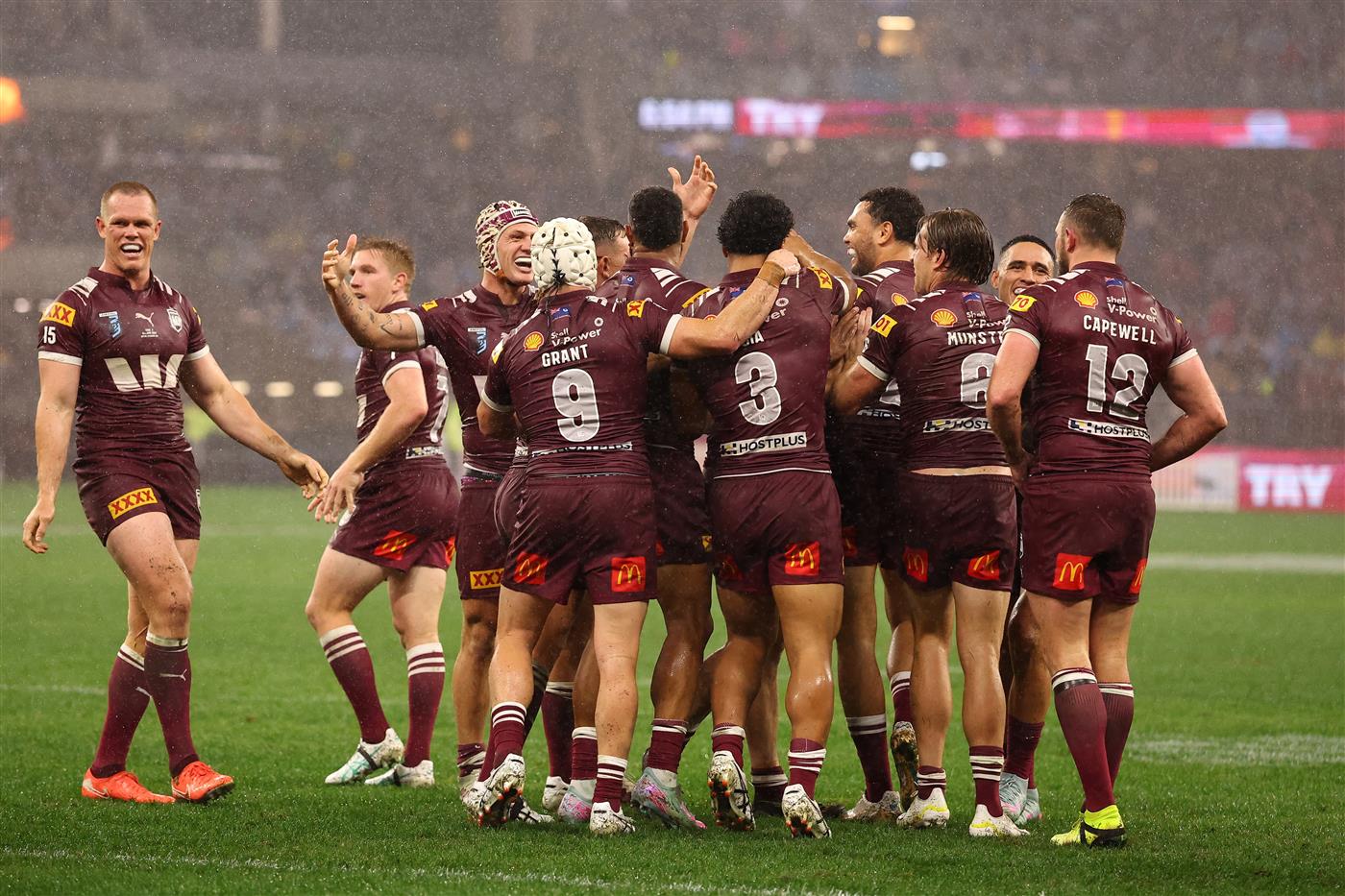 PERTH, AUSTRALIA - JUNE 18: Kurt Capewell of the Maroons celebrates scoring a try with teammates during game two of the Men