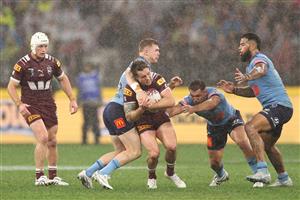 PERTH, AUSTRALIA - JUNE 18: Cameron Munster of the Maroons is tackled during game two of the Men