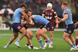 PERTH, AUSTRALIA - JUNE 18: Cameron Munster of the Maroons is tackled by Payne Haas of the Blues during game two of the Men