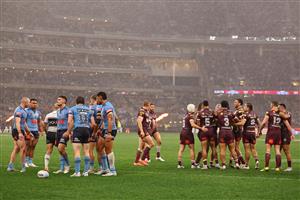 PERTH, AUSTRALIA - JUNE 18: Kurt Capewell of the Maroons celebrates scoring a try with teammates during game two of the Men