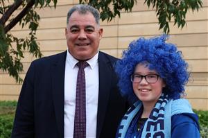 PERTH, AUSTRALIA - JUNE 18: Mal Meninga poses with a Blues fan before game two of the Men