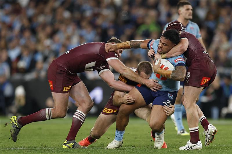 SYDNEY, AUSTRALIA - JULY 09: Spencer Leniu of the Blues is tackled during game three of the Men